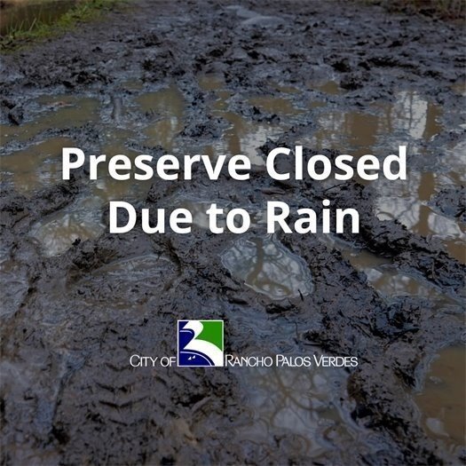 Picture of muddy trails as background with text in the foreground stating the Preserve is closed due to rain.