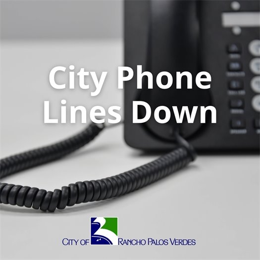 An office phone rests on a desk. A headline above the City of Rancho Palos Verdes logo says City Phone Lines Down.