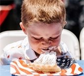 kid eating pie