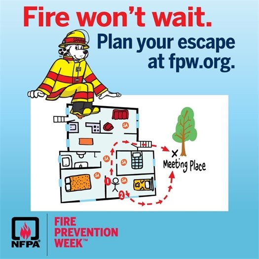 Sparky the fire dog sits on a board displaying a home escape route with a designated meeting place outside under a tree. A headline above the National Fire Protection Association Fire Prevention Week logo says Fire won't wait. Plan your escape at fwp.org.