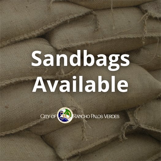 Sandbags that protect property against storm runoff are stacked. A headline under the City of Rancho Palos Verdes logo says Sandbags Available.